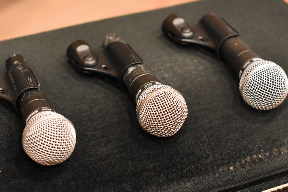 Three Shure SM58 dynamic microphones